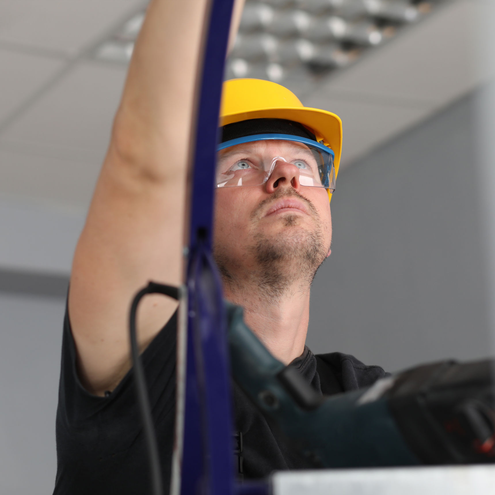 Håndværker på stige