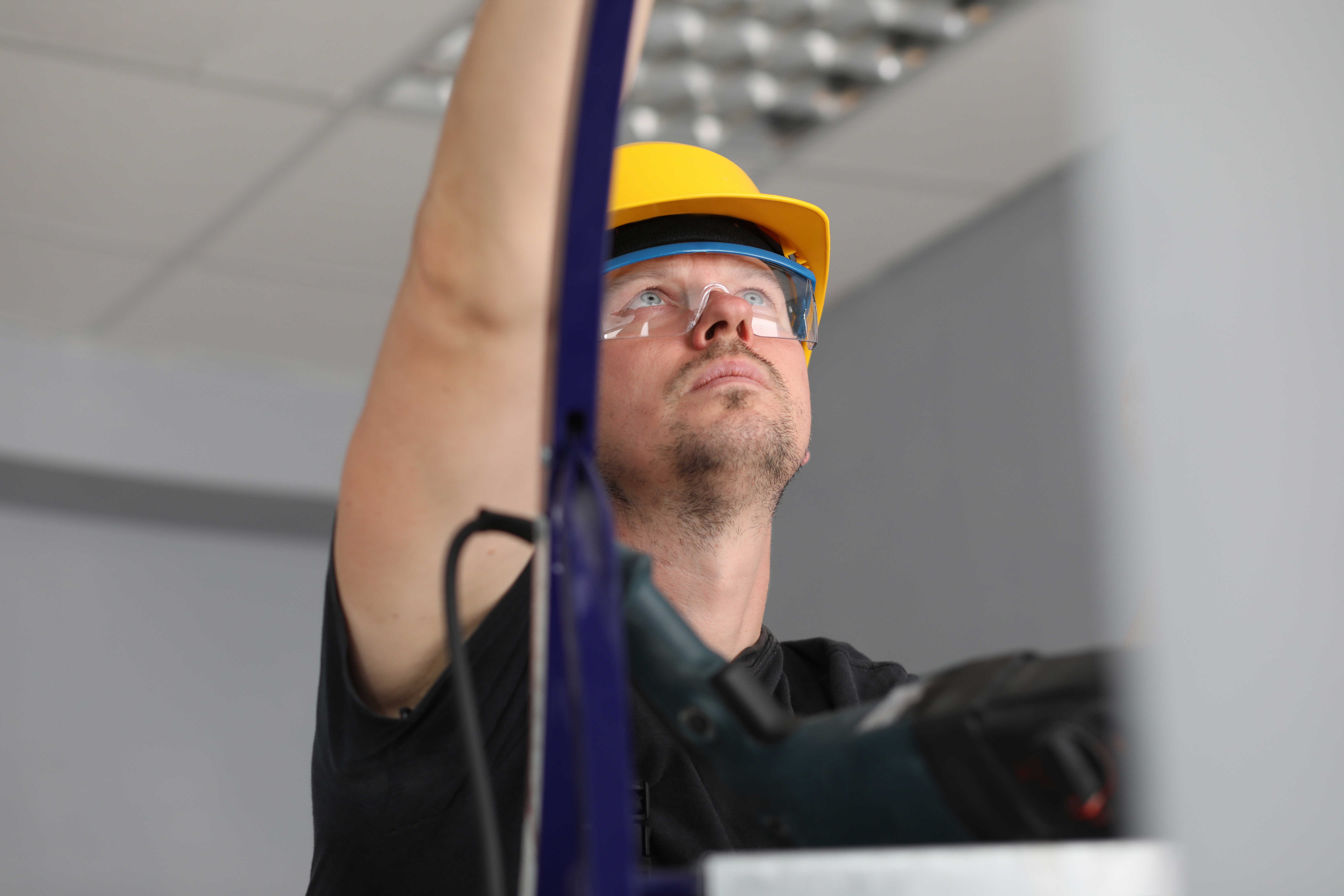 Håndværker på stige