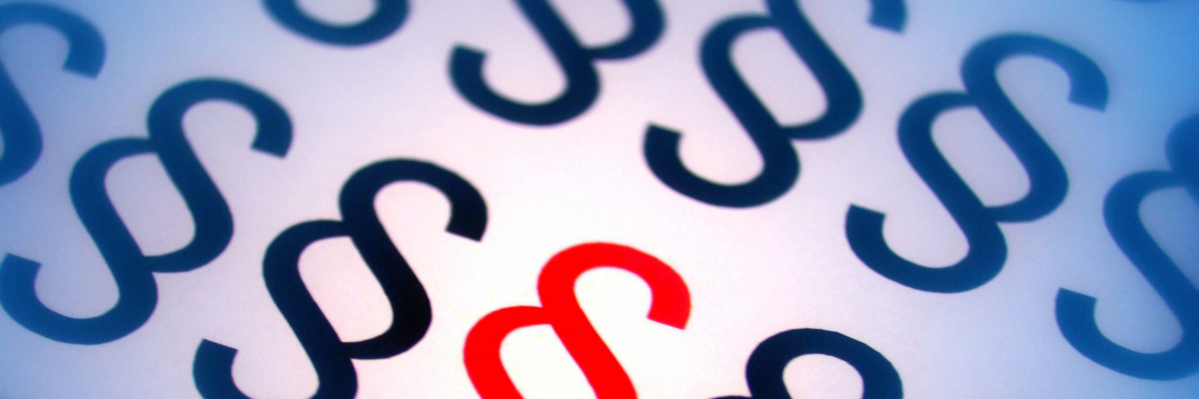 Sorte paragraftegn og et enkelt rødt